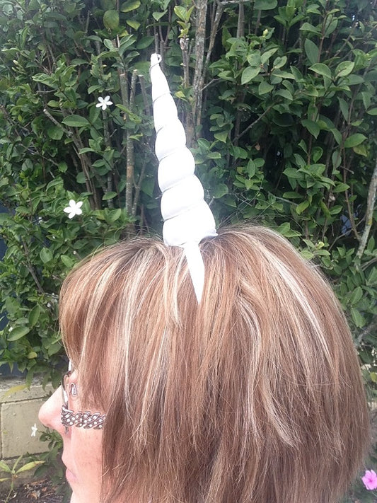 Attach a unicorn horn to a headband