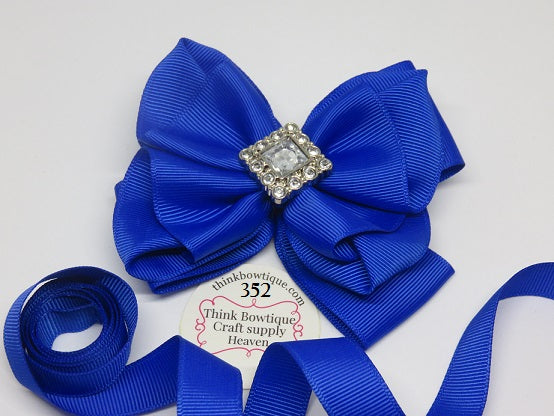 Embellish a ribbon bow with rhinestone buttons